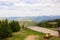 Take-off and landing pad for rescue helicopters in the green mountains. A helicopter landing sign at the peak of a mountain