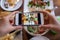 Take a photo of a smartphone for lunch or dinner. Woman taking picture with phone. Posting or sharing popular food for social