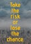 Take the risk or lose the chance text over cityscape in background