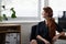 Take the time to unwind your mind. a beautiful young businesswoman sitting at her desk and looking out the window.