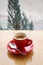 Take view with Red cup of Espresso on wooden table background.