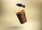 Takeaway paper cup with splashing coffee falling on beige background