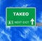 TAKEO road sign against clear blue sky