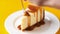 Taking bite of caramel cheesecake with fork