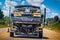 Taking the boat to the lake - Speedboat on boat trailer viewed from behind with blurred trees and foliage in background and