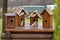 Taking care of the birds. DIY birdhouses close-up, side view