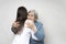 Taking care for the elderly. Young doctor hugs an elderly woman.