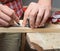 Taking the measurements of the wooden board