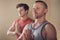 Taking a moment to slow things down. two young yogis standing together and meditating with their palms together after an