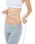 Taking off inches and feeling trim. Cropped studio shot of a woman measuring her waist with a measuring tape -Isolated