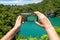 Taking Photo of Emerald Lake in Angthong National Marine Park in Thailand on Mobile Phone