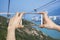 Taking picture of Ngong Ping Cable Car in Hong Kong with smartphone