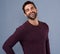 Taking a positive stance in life. Studio shot of a handsome and happy young man posing against a gray background.