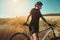 Taking in the scenery. an adventurous woman out cycling in the countryside.