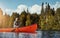 Taking it slow on the h2O. an attractive young woman spending a day kayaking on the lake.