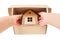 Taking wooden toy house out of a cardboard box