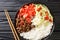 Takoraisu Taco rice is a Japanese dish hailing from Okinawa close-up in a bowl. Horizontal top view