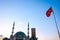 Taksim Mosque. Republic Monument and Turkish flag with mosque