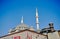 Taksim square covered by many Turkish flag and taksim mosque almost finished. Ataturk