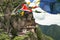 Taktsang Palphug Monastery with prayer flag (also known as The Tiger nest temple), Paro, Bhutan