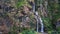 Tal - A tall waterfall flowing down the Himalayan slopes