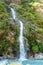 Tal - A tall waterfall flowing down the Himalayan slopes