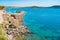 Talamone rocky beach, medieval fortress and walls, Argentario, Tuscany, Italy