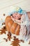 Tale of Cinderella. Little beautiful newborn baby girl in a bonnet sleeping on a pumpkin