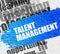 Talent Management on White Brickwall.