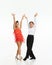 Talented, beautiful, artistic children, boy and girl in stage costumes dancing retro style dance against white studio