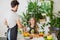 Talented chef teaching positive beautiful girl to prepare refres