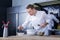 Talented cook preparing an unusual dish in the kitchen