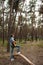 Talented guitarist playing forest hiking concept.