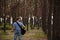 Talented guitarist playing forest hiking concept.