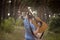 Talented guitarist playing forest hiking concept.