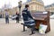 A talented homeless musician plays the piano in the street