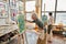 talented mature women painting on easels