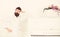 Talented musician concept. Man with beard in bathrobe enjoys morning while standing near piano. Man serious stands and