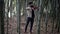 talented musician is playing fiddle in nature, musician is rehearsing in bamboo grove