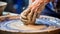 Talented potter shaping matching ceramic pieces on pottery wheel in vibrant workshop studio