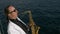 Talented saxophonist performs jazz on yacht