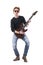 Talented skillful rock music guitarist playing solo on electric guitar wearing sunglasses.
