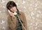 Talking telephone retro woman on vintage wallpaper