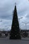 Tall beautiful Christmas tree near the shopping center. Moscow. Russia.