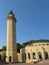 Tall beige minaret of the Ar-Rahma Mosque, vertical photo