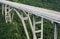 Tall bridge crossing a green valley