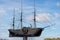 A tall bronze ship sculpture located along the riverfront in Savannah, Georgia