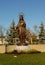 A tall bronze statue of Mother Mary.