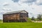 Tall Brown Barn Building with Boards