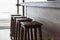 Tall brown wood chair Placed at the bar counter by the sea